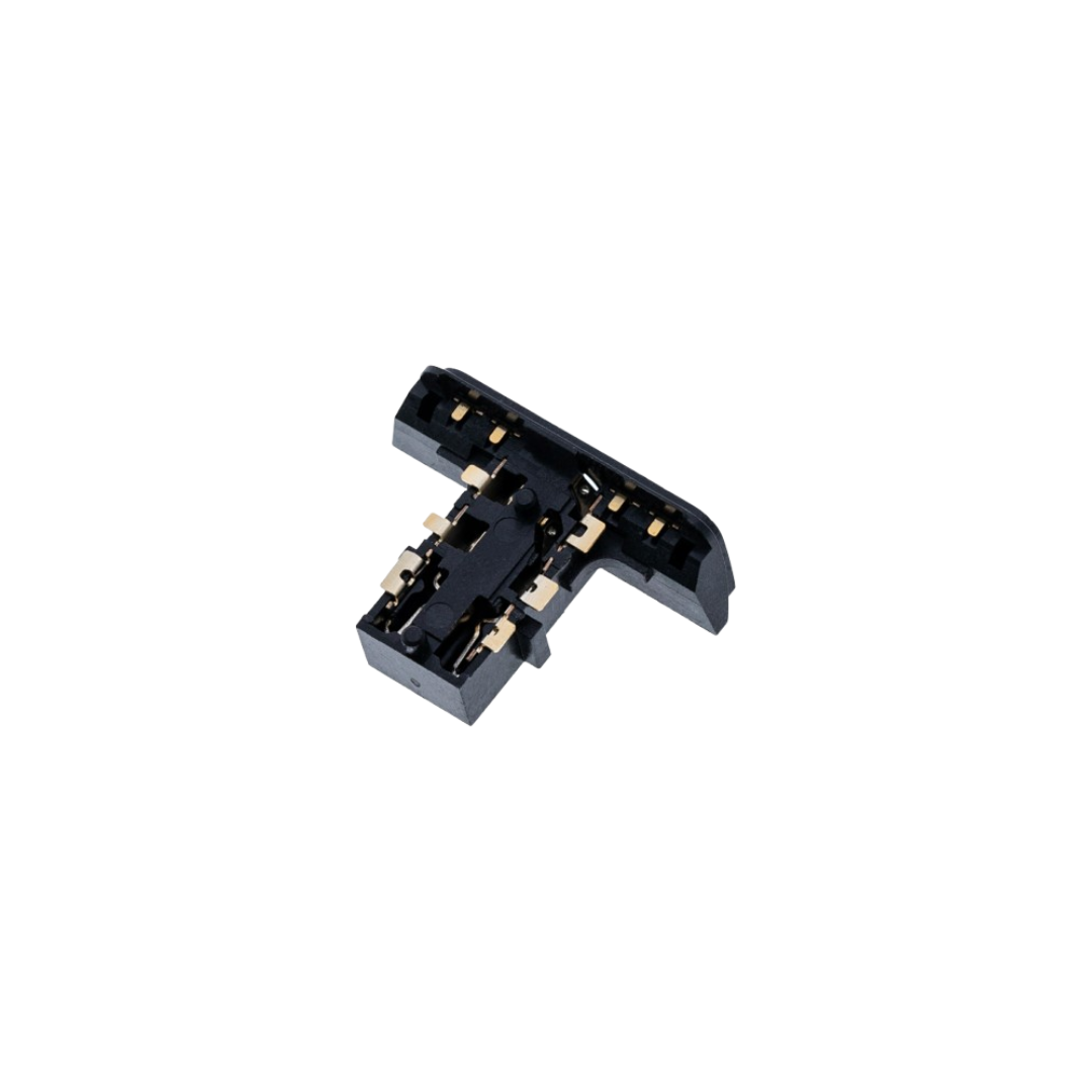 Close-up of headphone jack replacement part with small gold contact points on a white background