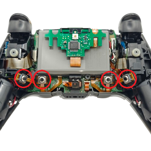 Inside of a PS5 SCUF controller showing the internal button assemblies, circuit board, ribbon cables, and four contact points circled in red