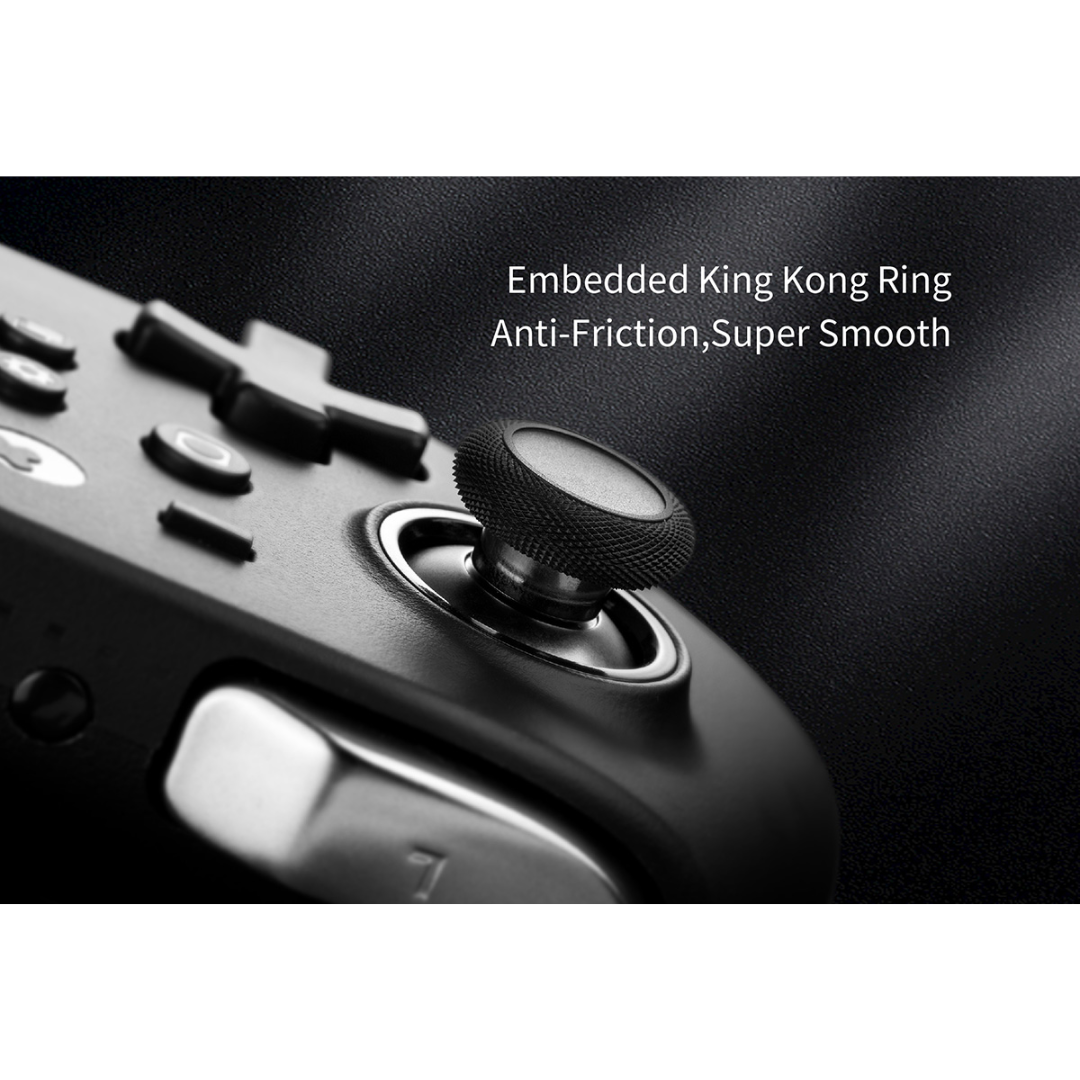 Close-up of a black controller thumbstick with text reading “Embedded King Kong Ring Anti-Friction, Super Smooth”