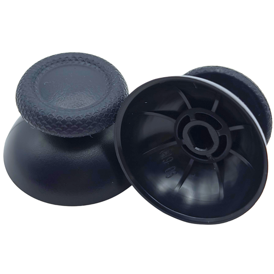 Pair of black controller thumbsticks, with one shown upright and the other showing the underside attachment socket on a white background
