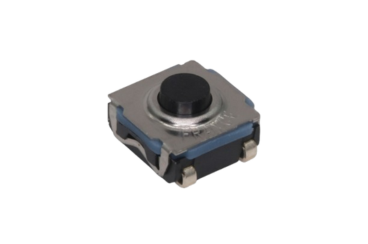 Close-up of a small tactile button switch component on a transparent background