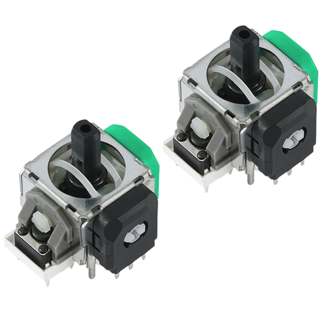 Pair of joystick modules with black center posts, silver metal frames, green side housings, gray plastic parts, and small metal pins on a white background