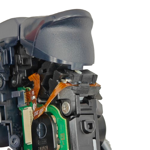 Close-up of the inside of a PS5 DualSense Edge controller showing the trigger assembly, ribbon cable, circuit board