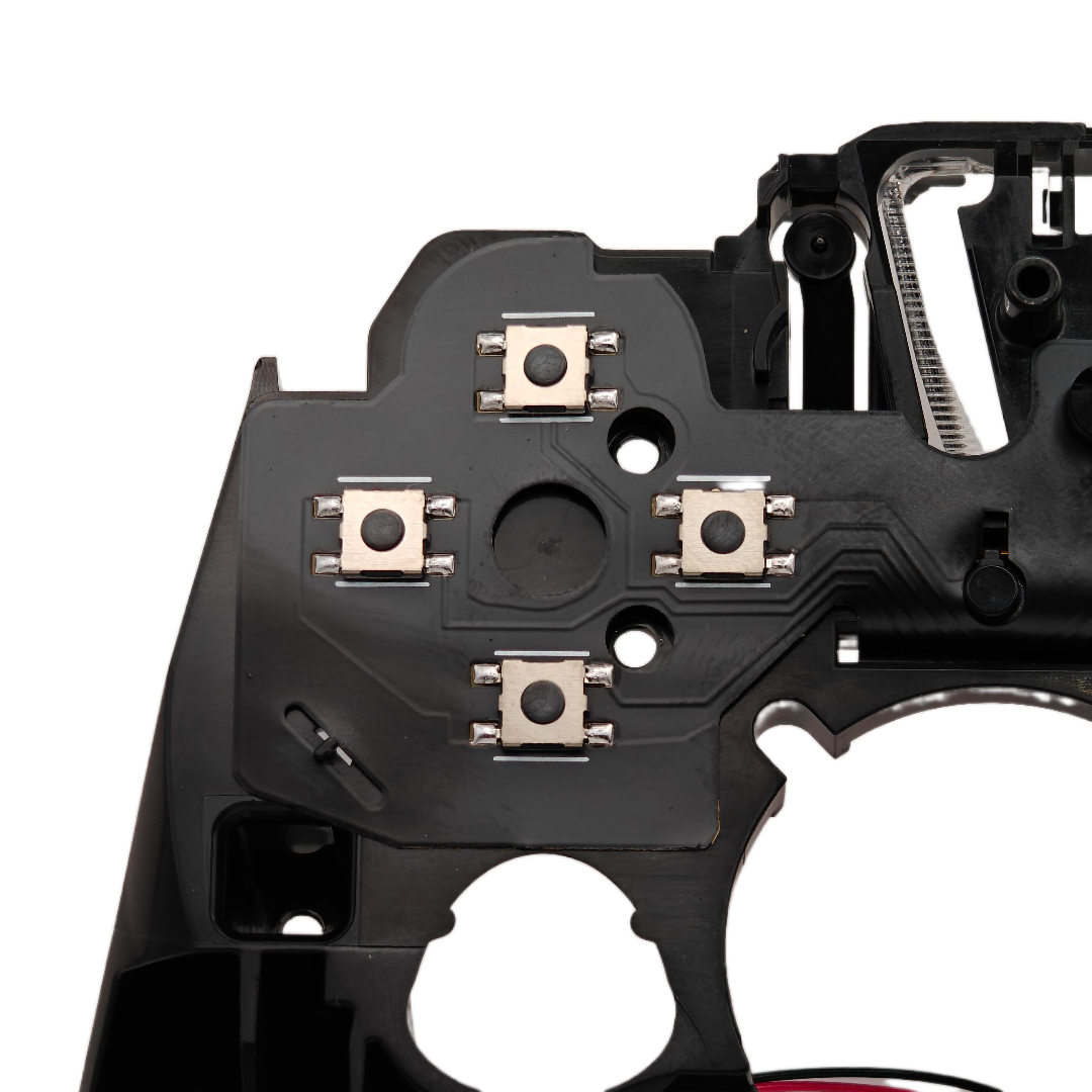 Close-up of the inside of a controller showing four small square button switches on a black internal circuit board against a transparent background